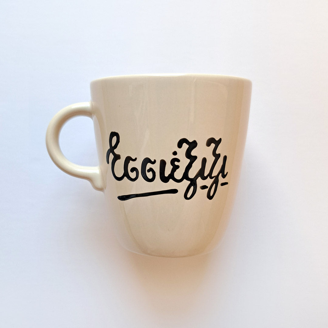 Hand painted black ceramic mug, "Εσσέξιξι"